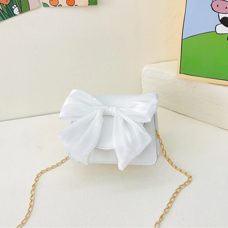 เด็ก Mini กระเป๋าถือน่ารัก Bowknot Crossbody กระเป๋าสำหรับเด็กทารก Pouch Koin Kawaii เด็กวัยหัดเดินหนังกระเป๋าถือและกระเป๋าเงินของขวัญ