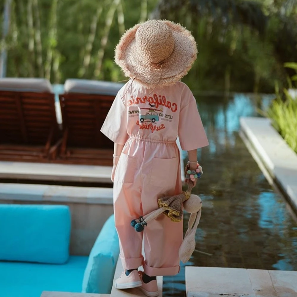 

2025 Korean Version Summer New Children's Costume Cartoon Printed Pink Pocket Work Pants Fashion Girls' Jumpsuit Short Sleeve