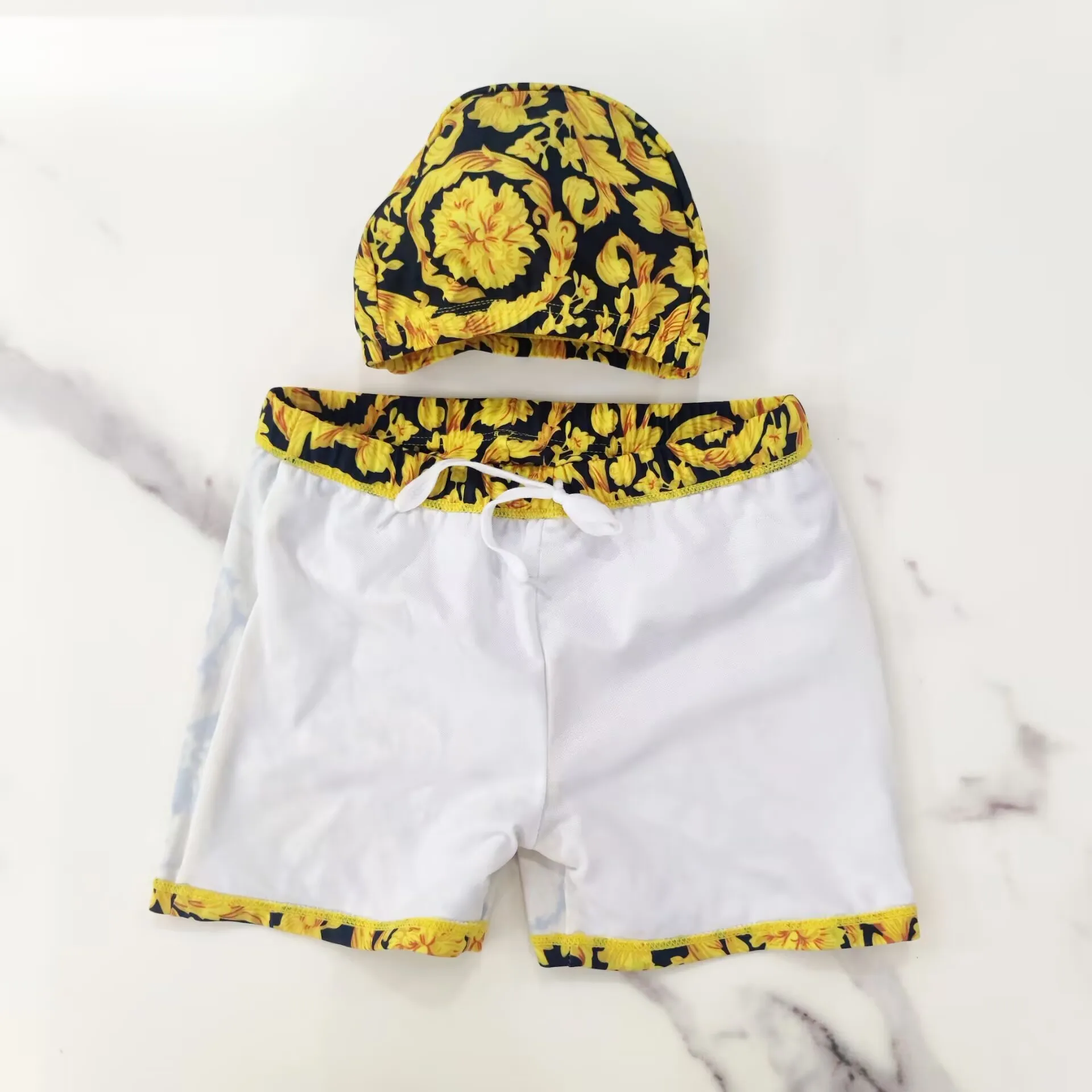 2025 Pantaloncini da bagno per bambini Maschio Baby Jacquard dorato Primavera calda Abbigliamento da bagno per babay 1-12 anni