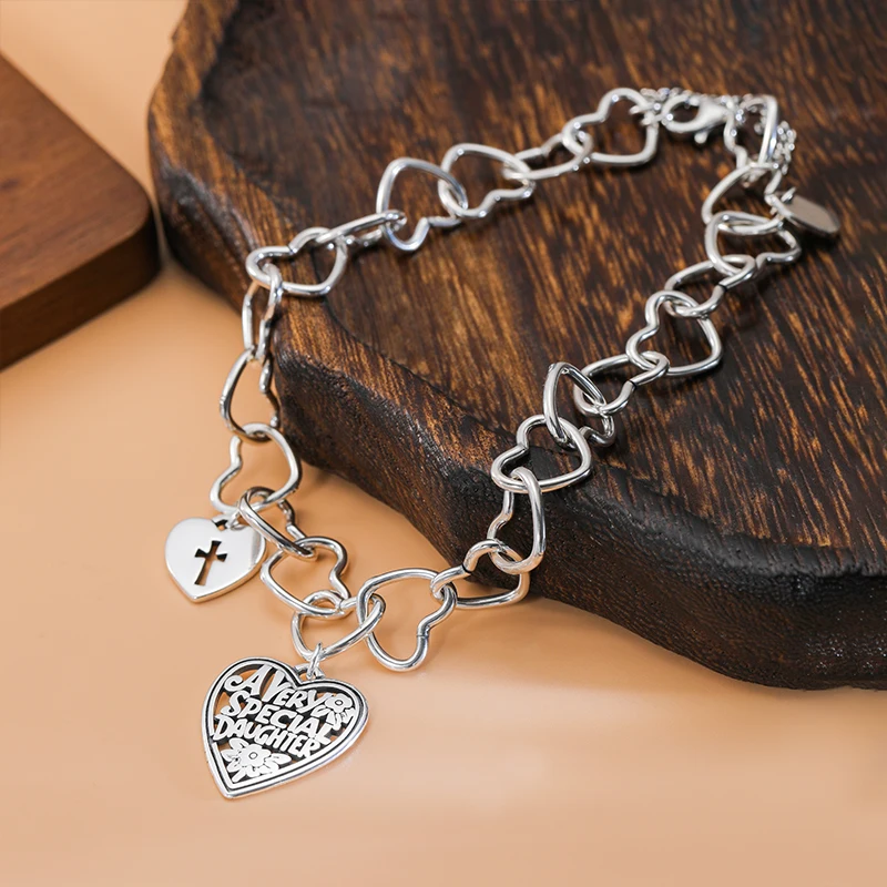 

925 sterling silver heart-shaped bracelet comes with a "Special Daughter" heart-shaped pendant adorned with a small cross