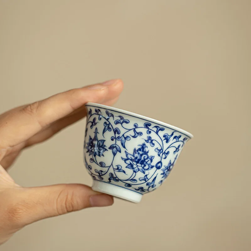 Handmade pressed hand cup blue and white host tea cup Kung Fu tea set guest cup entwined lotus tea cup tea set ceramic