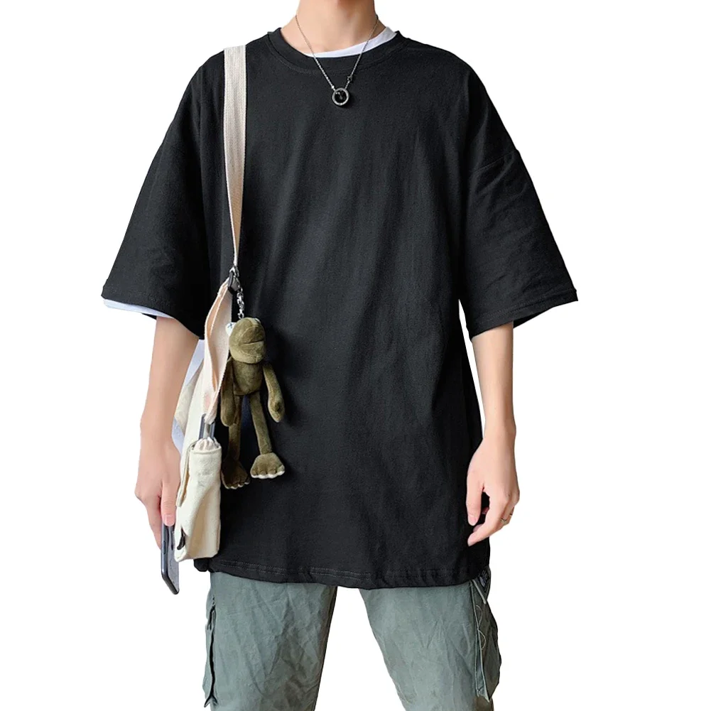 การออกนอกบ้านแบบสบาย ๆ ใช้ทุกวันเสื้อยืดแขนสั้นสีดําเสื้อผ้าทรงหลวมลําลองแขนสั้นลายสีทึบ