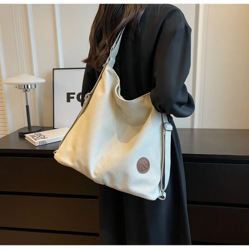 Lightweight and fashionable bag for women, new high-capacity tote bag, dual-purpose backpack, canvas commuting bag