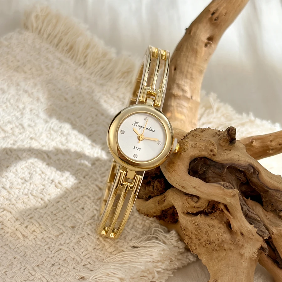 Fashion Round Dial Three-Rod Curved Bracelet Gold Watch for Woman