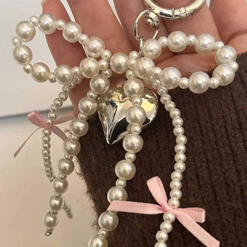 Y2K INS اللؤلؤ Bowknot المفاتيح النساء اللؤلؤ شرابات الوردي الشريط الحلو معلقة Keyrings ظهره حلقة رئيسية اليدوية مجوهرات هدايا