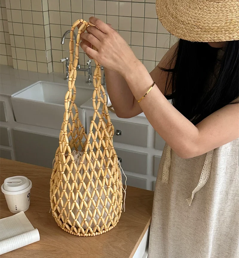 

Women's Bag Designer Luxury Bag Handwoven Hollow Out Wooden Bead Tote Bag Bucket Bag Vacation Handbag Shoulder Bag Beach Bag