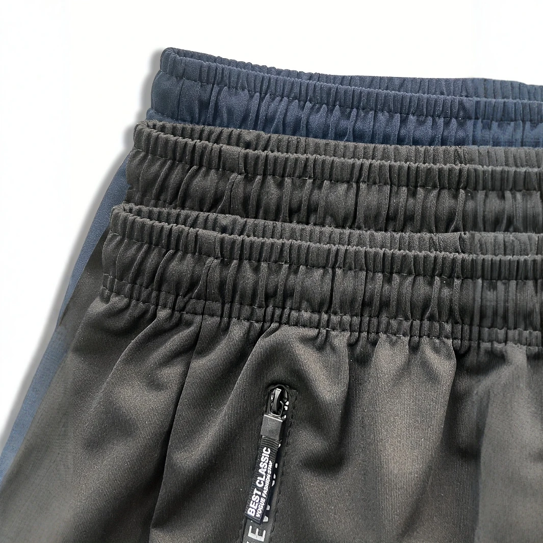 Zip Pockets Set of Three Solid Color Regular Fit Joggers Elastic Cuffs, Zip Pockets, Letter Prints, Drawstrings Suitable for Wor