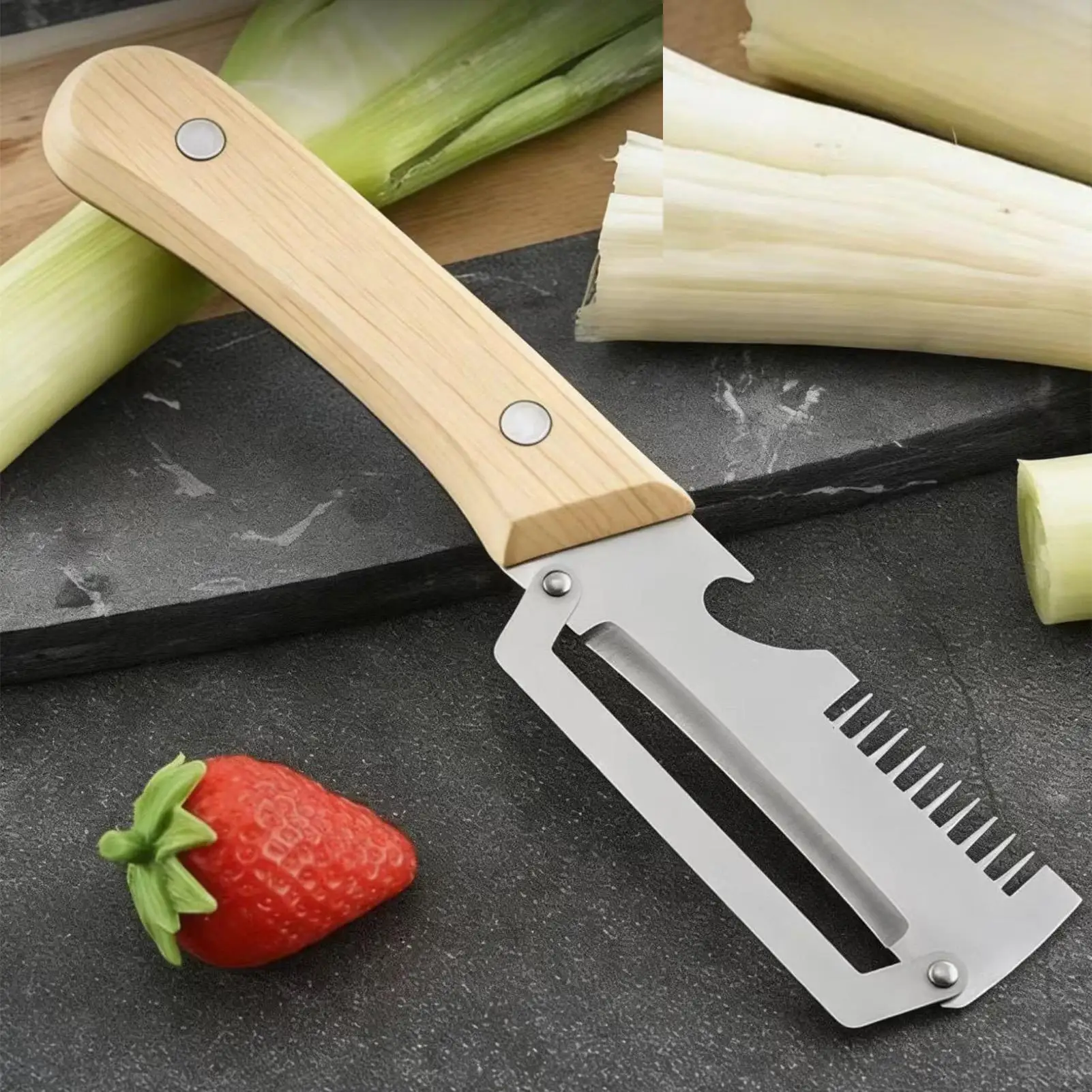 Stainless steel peeler with wooden handle for peeling and slicing fruits and vegetables Durable smooth operation Scallion slices