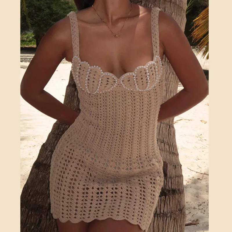 Minivestido Sexy de punto con cuentas de perlas para mujer, vestidos de playa huecos sin mangas de punto de ganchillo, ropa de playa ceñida para primavera y verano