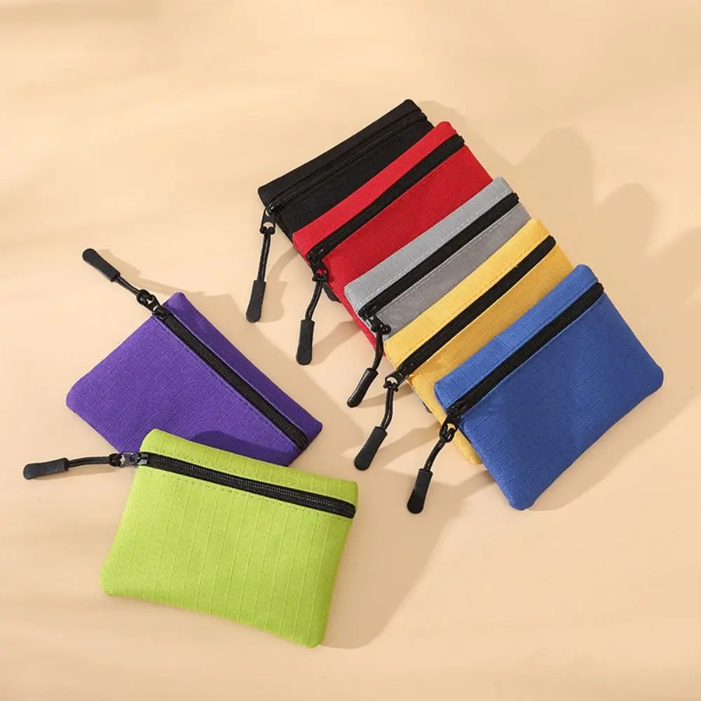 Mini monedero Simple de Color sólido para hombres y mujeres, bolsa de almacenamiento de lona para niños, bolsa para llaves de monedas, billetera pequeña con cremallera