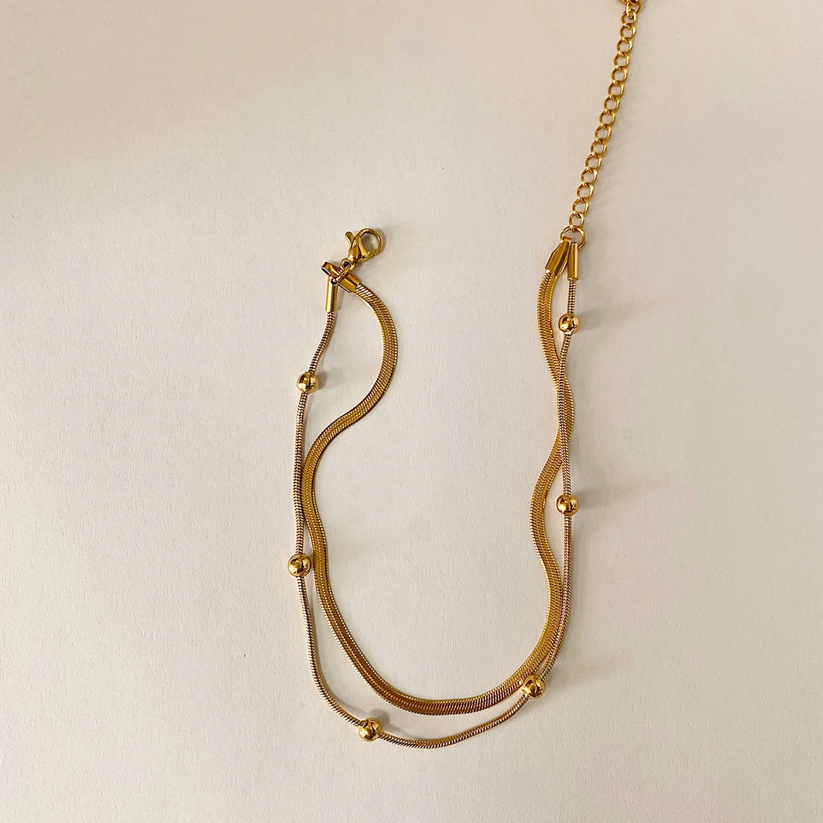 

Lxalry 18K Gold Plated Double Layer Snake Chain Anklet – Waterproof Summer Beach Jewelry with Gold Beads for Women and Men