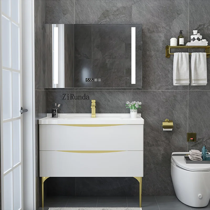 The glossy white painted bathroom vanity is all white with gold legs