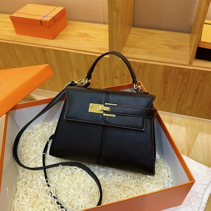 

Simple Fashionable High-End Diaper Bag An Elegant Designer Leather Shoulder Bag For The Stylish Luxury Commuter