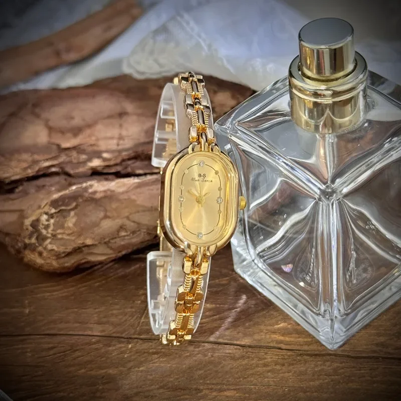 

Винтажные роскошные золотые кварцевые часы из сплава, тонкий браслет, корпус трековой формы, элегантные женские универсальные часы с эллипсом