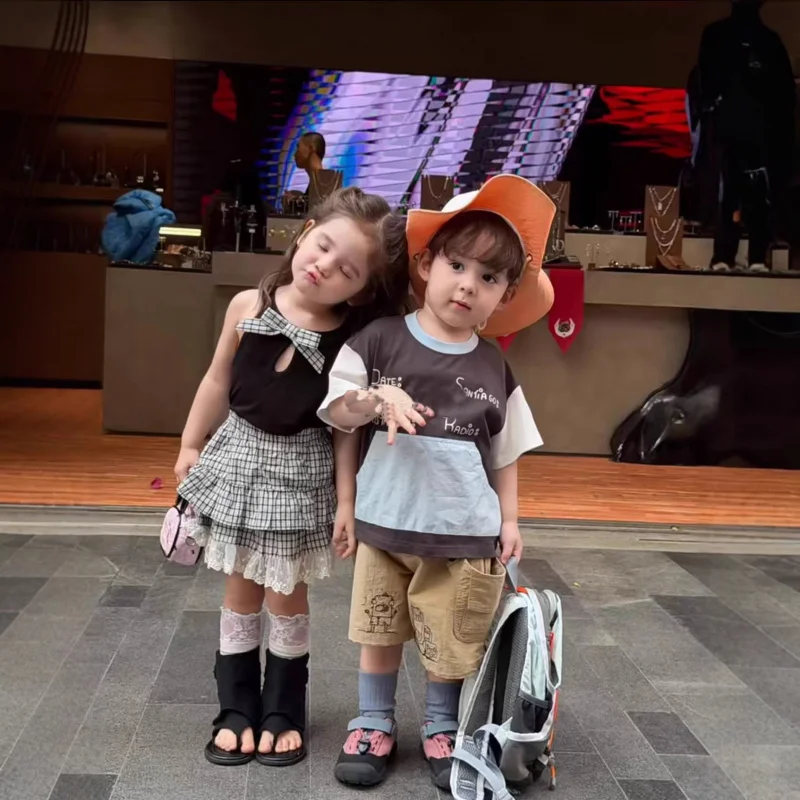 

Girls' Summer Outfit Set2026New children's bowknot vest top and toddler plaid lace cake skirt