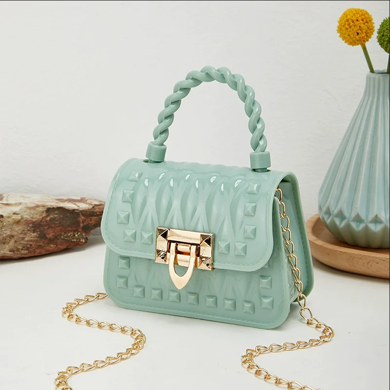 Nouvelle chaîne de verrouillage PVC Portable Mini sac de gelée Rivet une épaule bandoulière rouge à lèvres petit sac sacs pour femmes sacs à main