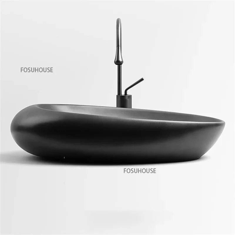 Nordic Ceramic Bathroom Sinks Oval Hotel Creative Countertop Basin Household Balcony Wash Hand Basin Bathroom art design basin