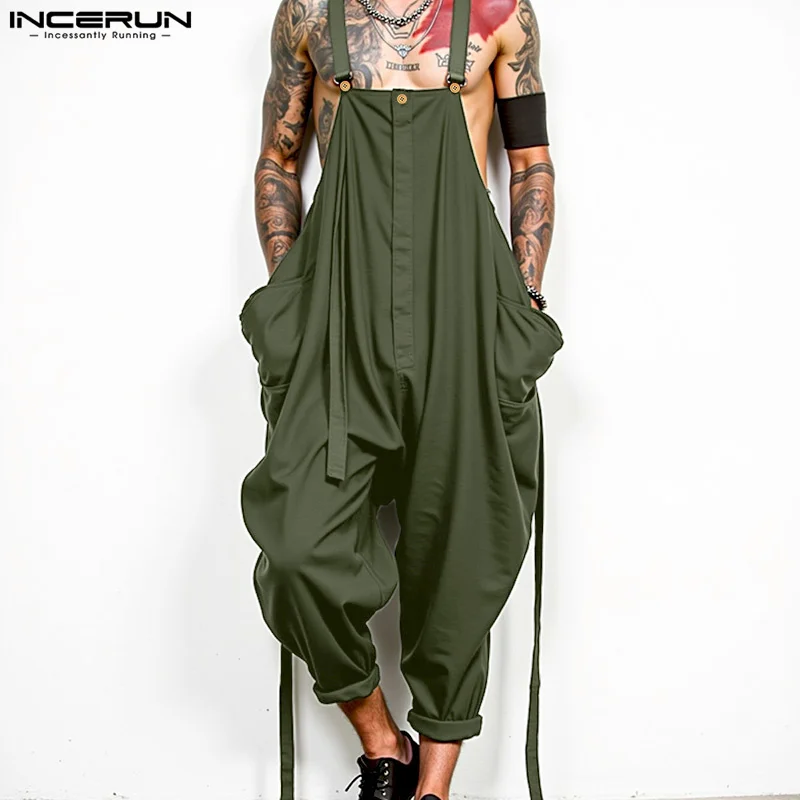 جمبسوت رجالي لعام 2025 بلون سادة مقاس كبير بدون أكمام ملابس خروج واسعة الساق ثوب فضفاض للرجال بجيوب فضفاضة وأشرطة عصرية وزرة INCERUN