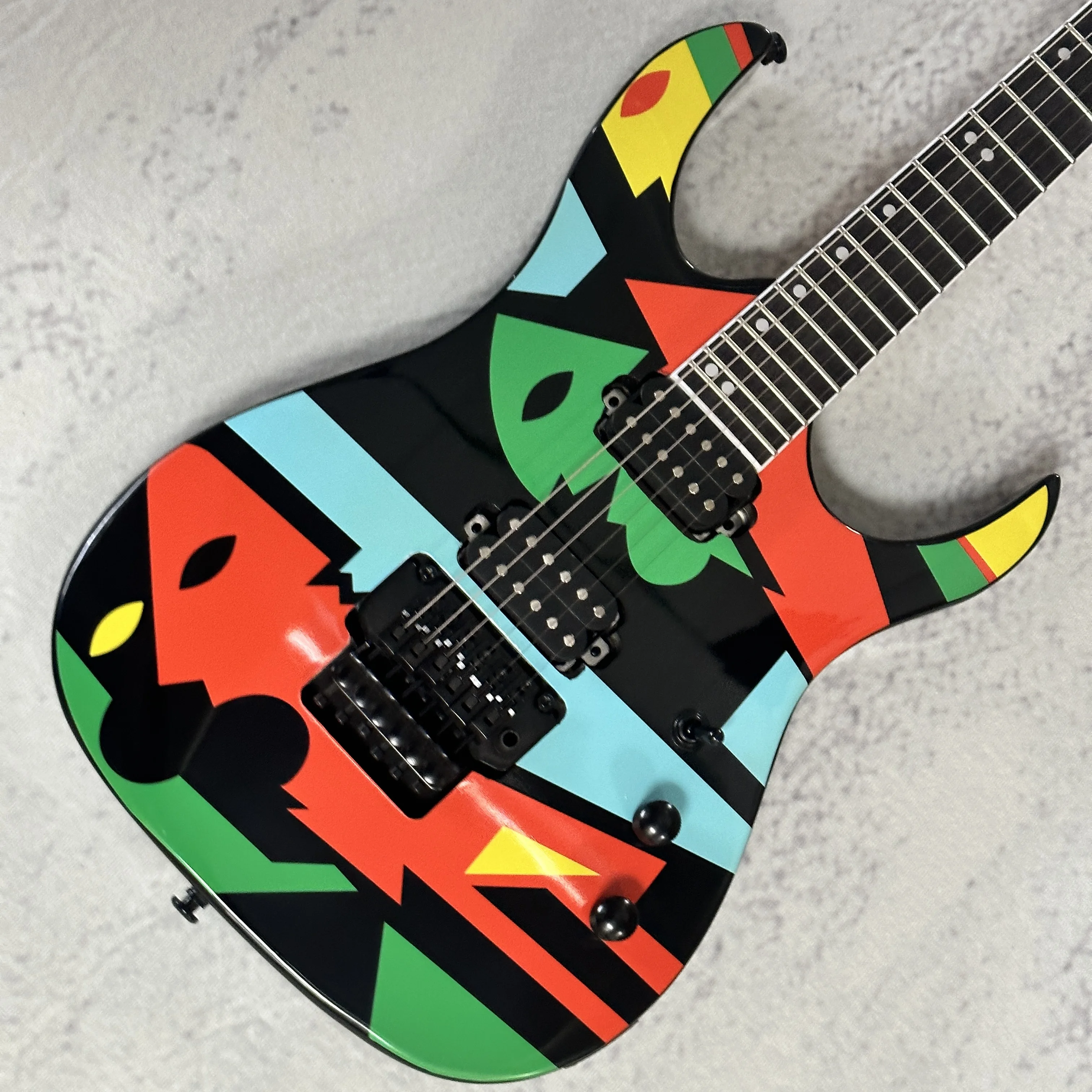 

Colorful six-string electric guitar, made of wood, with high-quality tone