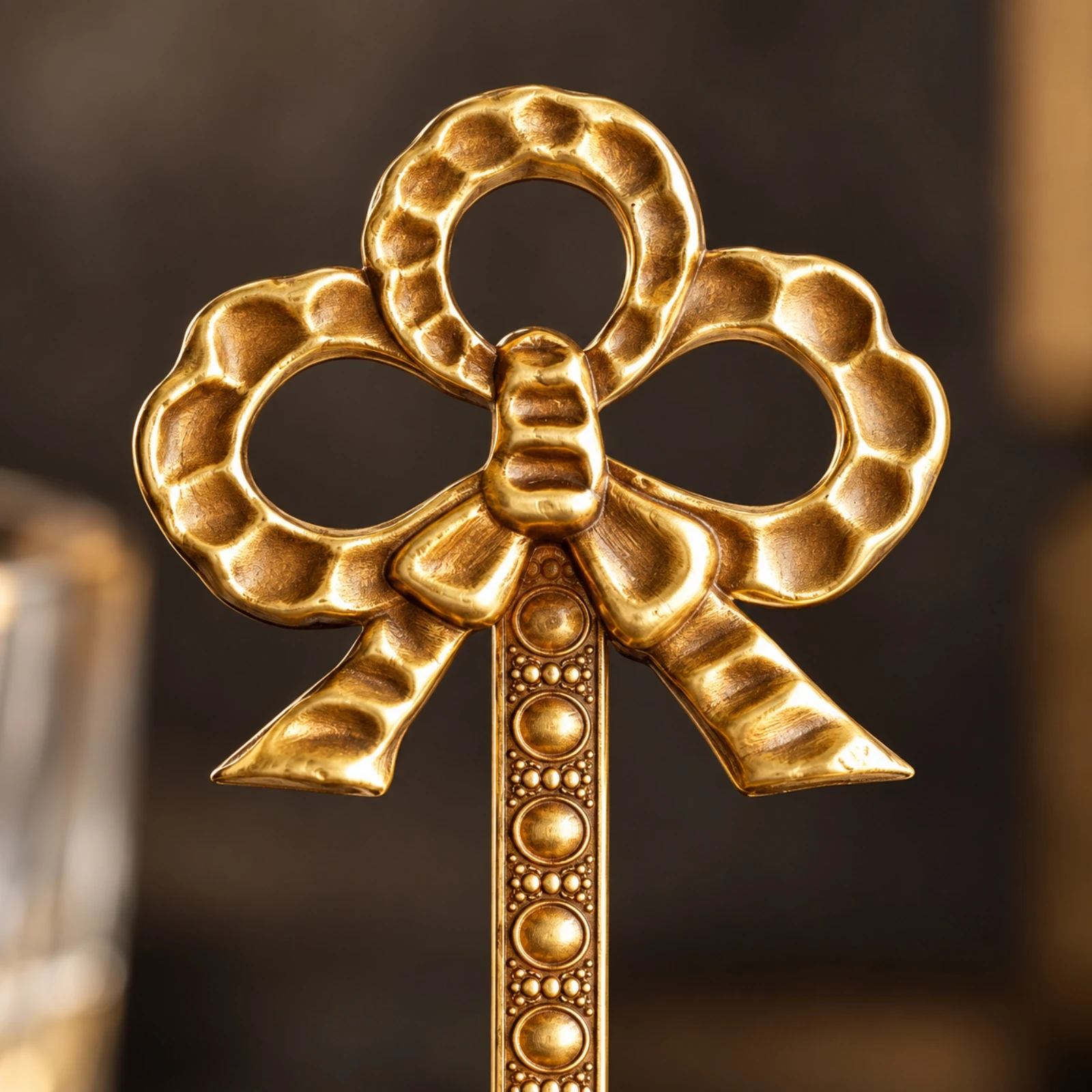 brass-finish-plate-display-stand-tabletop-ornate-plate-holder-with-bow-motif-bow-shaped-display-stand-metal-polished
