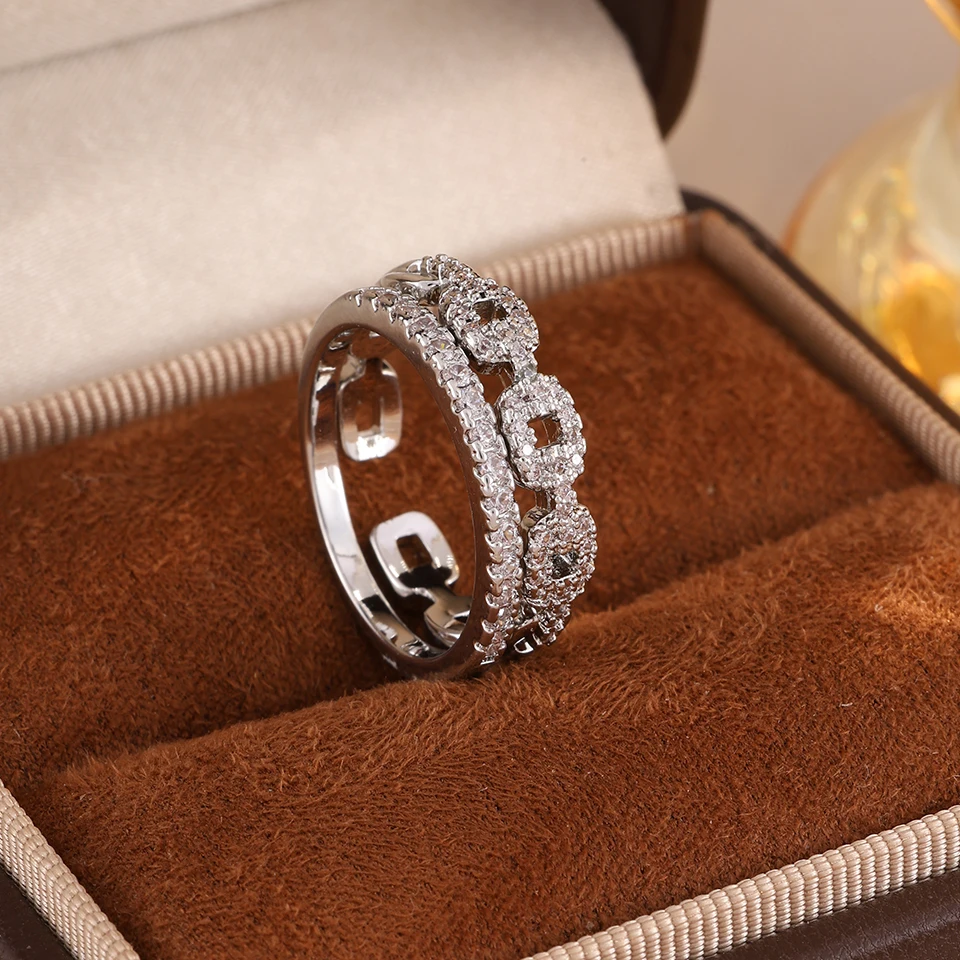 ZAKOL Exquisiter funkelnder Zirkon-Verlobungsring, geometrisches hohles Design, Braut-Ehering, Schmuck, Geschenk, 2026, Neu