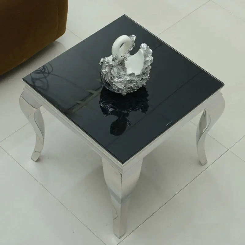 A few small coffee tables with luxurious gold edges. Marble tempered glass cube A few high-grade square corners beside the sofa