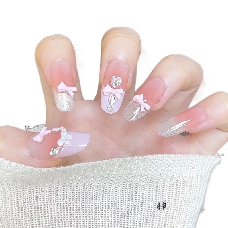

Sweet pink bow manicure advanced cat's eye French gradual change pearl wearing nail piece