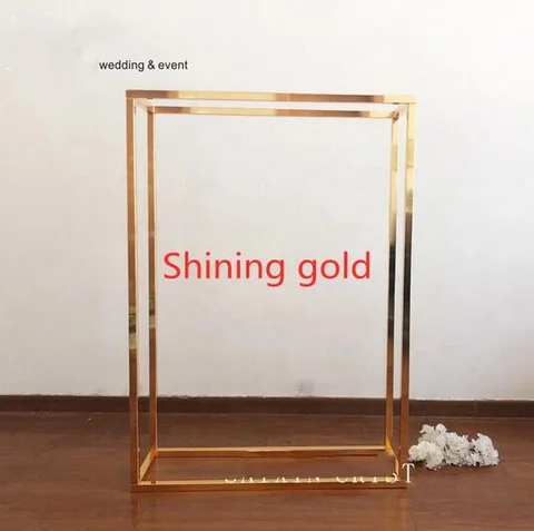 A shiny golden rectangular metal photo frame, wedding pergola, table center piece, wedding decoration