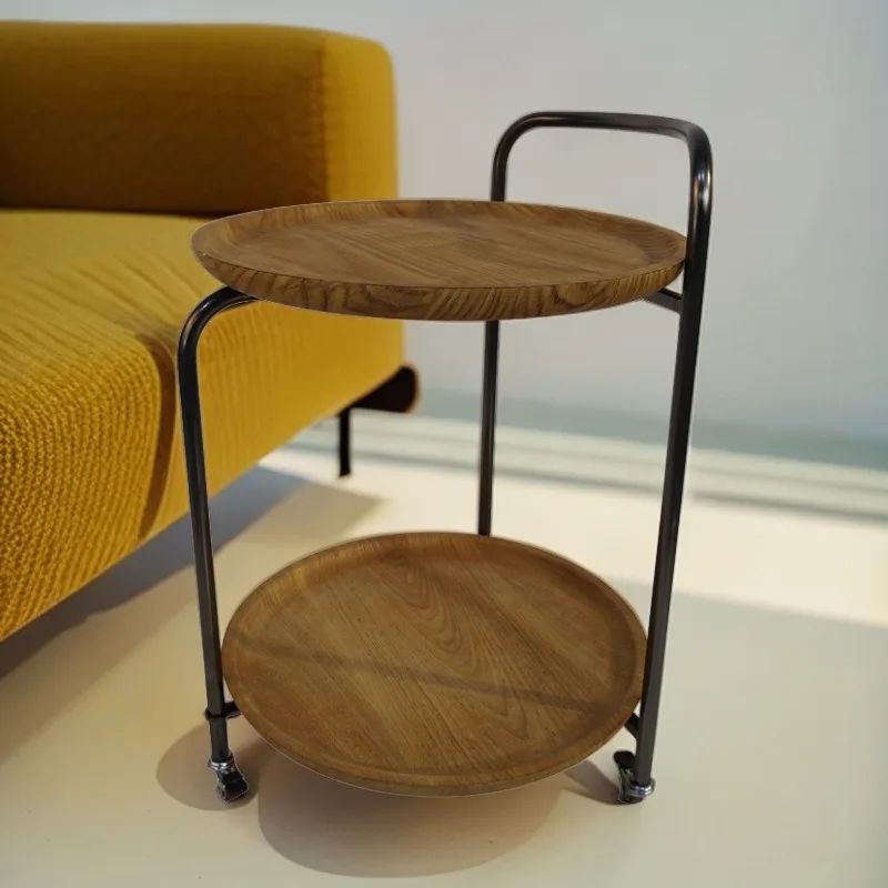 A few wrought iron retro bedside plastic stickers on the edge of the veneer cart in the living room corner