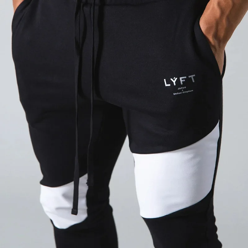 Nuovi pantaloni Fitness lavorati a maglia a due colori con cuciture di tendenza pantaloni sportivi Casual da basket pantaloni sportivi a matita