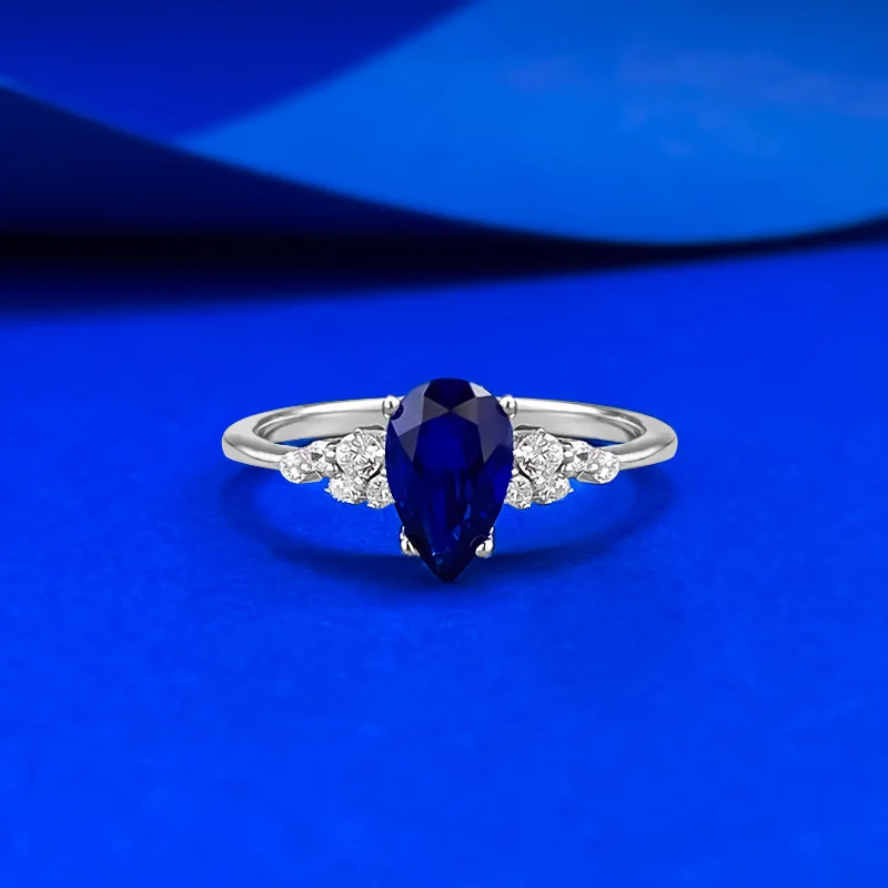 

S925 Silver Ring Royal Blue 5 * 8mm Pear shaped Zircon Four Claws with Water Drop Wings Design, High end Women's Jewelry
