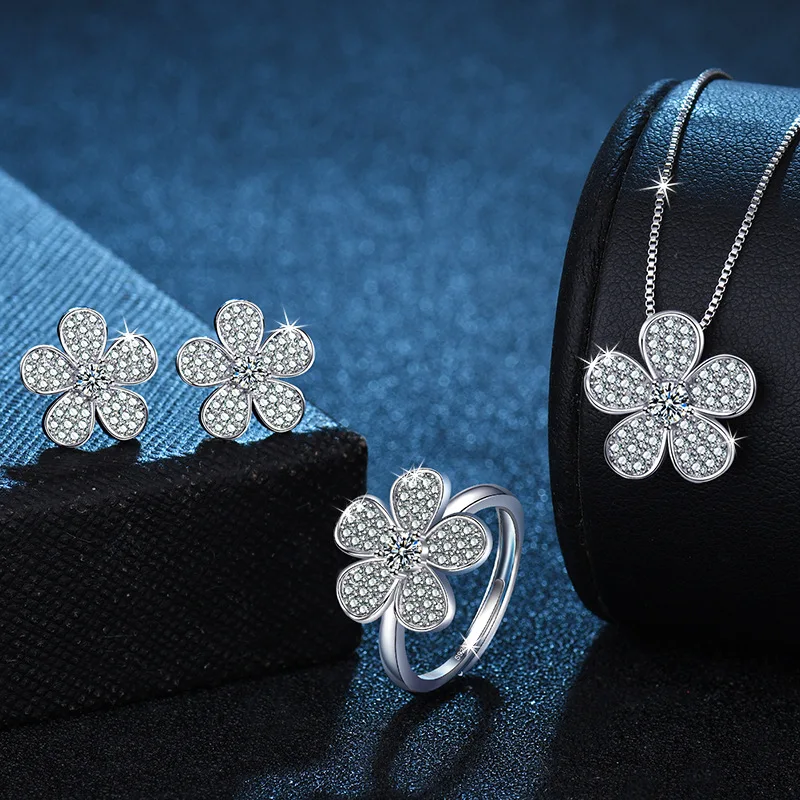 

This luxurious 3-piece set of zirconia flower necklace, ring and stud earrings is a stainless steel cubic zirconia couple aesthe