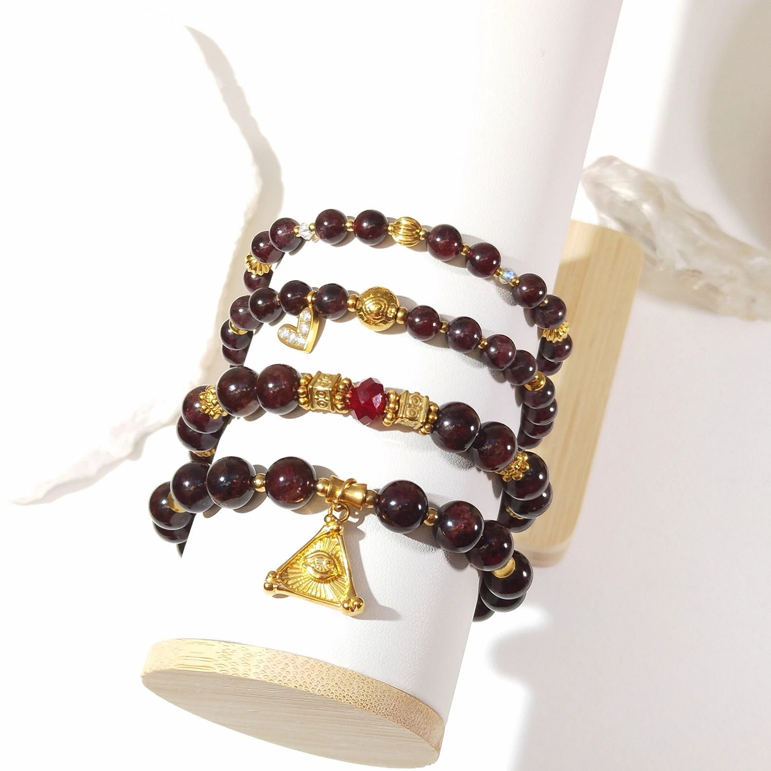 

Lii Ji Natural Stone Garnet 6/8mm With Crystal Stainless Steel Elastic Bracelet