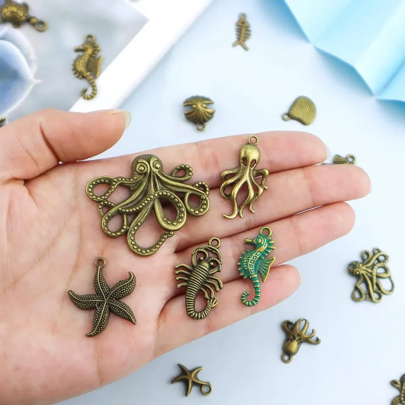 28 Pcs Assorted Antique Ocean Themed Charms Bronze Ocean Fish Sea Creatures Beads Pendants for Jewelry Making and Craft Making