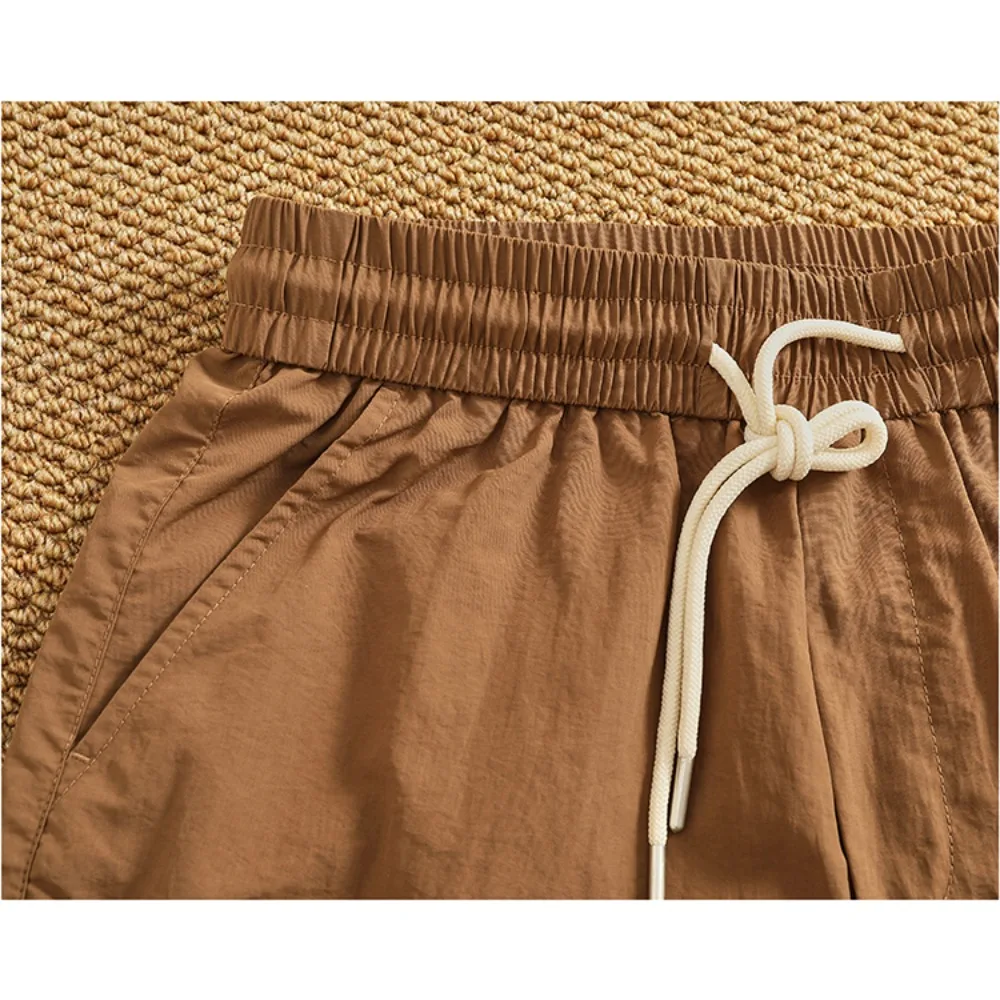 شورت سريع الجفاف للرجال بنمط جديد شورت عمل عصري وفضفاض للرجال صيفي متعدد الاستخدامات سروال خمس نقاط غير رسمي