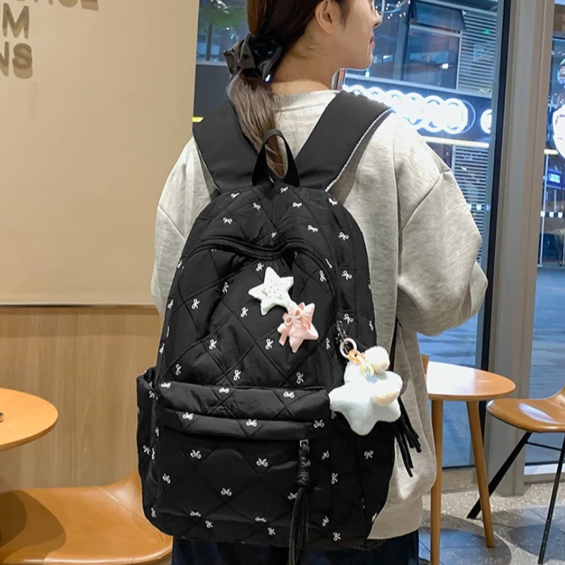 Soft Quilted Backpack Printed with Tiny Bow, Tassel Zipper, Lightweight Casual School Bag with Side Pockets for Students Study