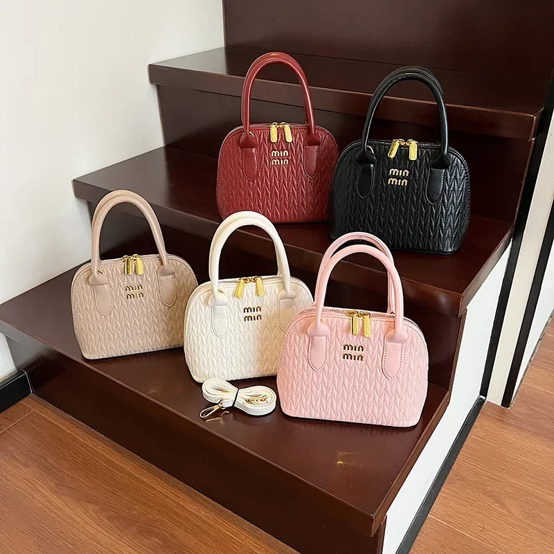 

Элегантная женская сумка-ракушка 2025 года, минималистичная изогнутая сумка через плечо, шикарная сумка через плечо с верхней ручкой, мягкий структурированный дизайн