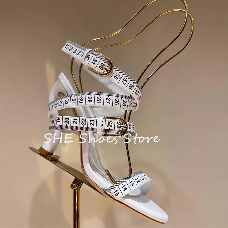

Fashion Design Tape-Measure Buckle Strap Women Sandals Peep Toe Narrow Band Stilettos High Heels Pumps Ladies Dress Shoes