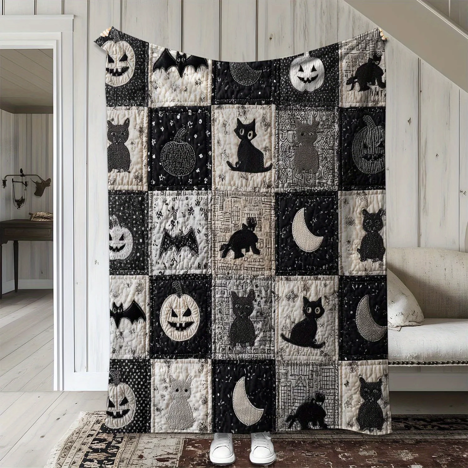 A Flannel Blanket Featuring a Vintage Patchwork Design with Bats, Ghost Faces, And Pumpkins for Halloween. This Warm, Soft, And