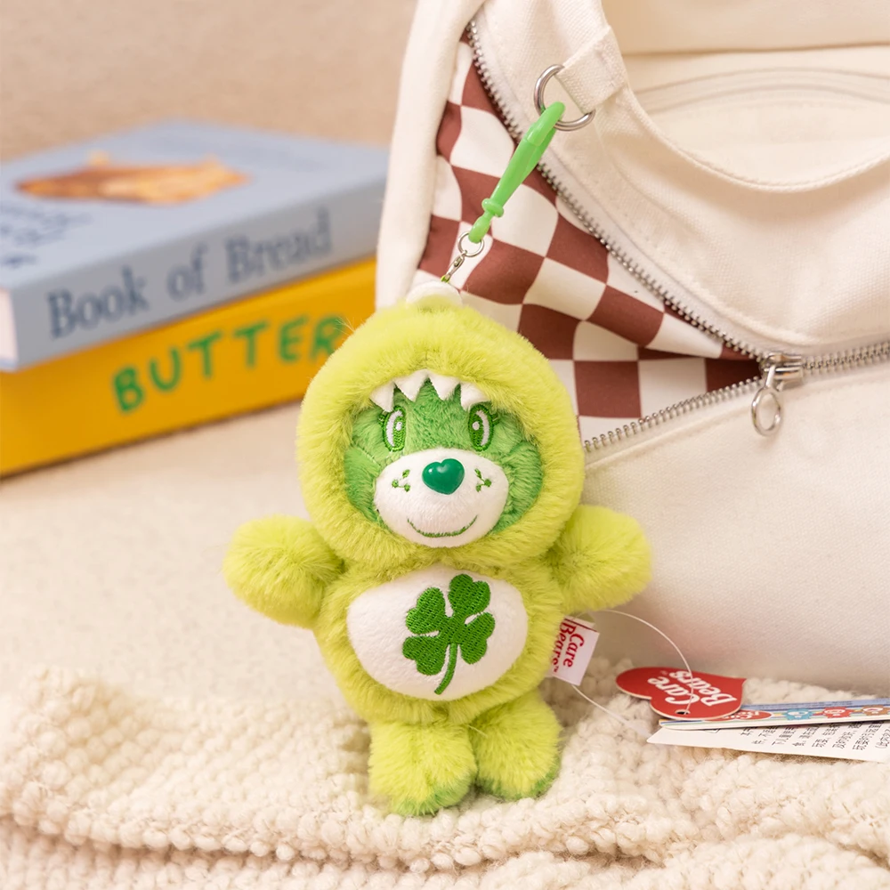 15 ซม.Care หมีไดโนเสาร์จี้ตุ๊กตากระเป๋าเป้สะพายหลังกระเป๋าตุ๊กตาพวงกุญแจน่ารักโทรศัพท์ตุ๊กตาหมีพวงกุญแจ