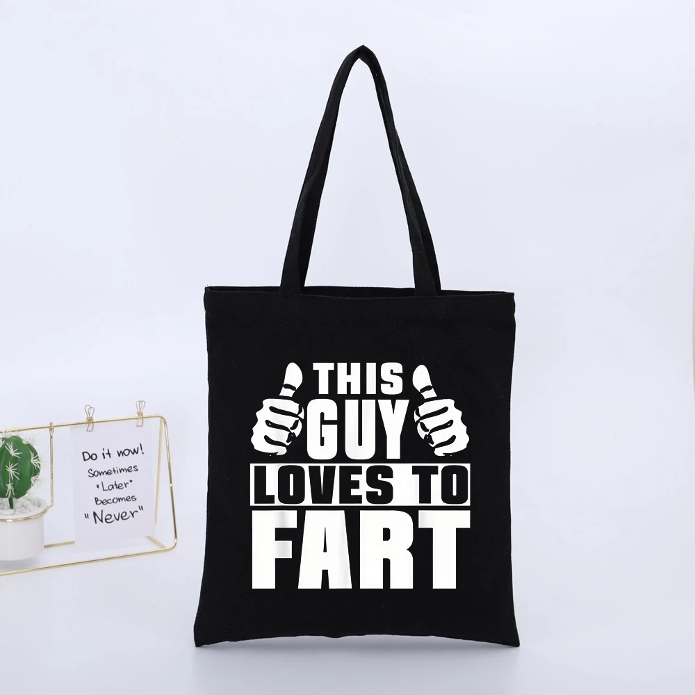 THIS GUY LOVES TO FART Graphic Black Canvas Tote Bag, Casual Style for Daily Shopping and Casual Outings