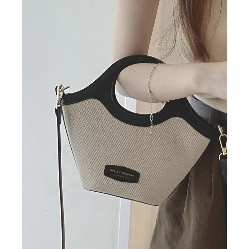 French minority design handbag bag female 2023 new fashion contrast stitching bucket bag high sense messenger bag