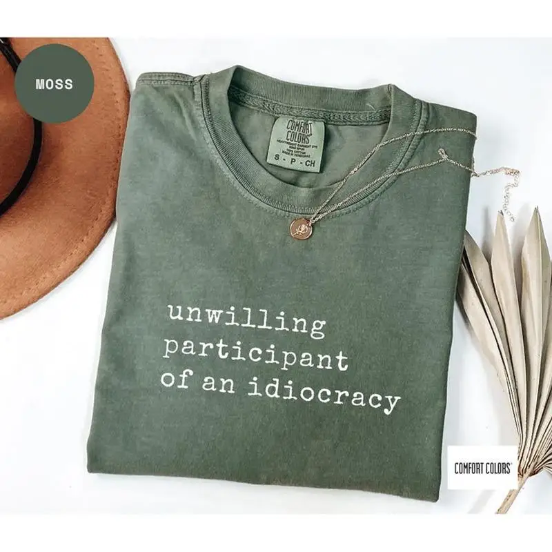 تي شيرت كاكستوكراسي من Comfort Colors Unwilling Participant of the Idiocracy #1