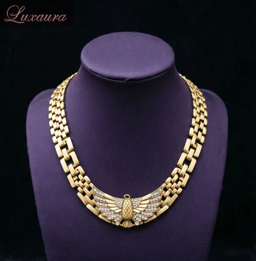 

Vintage jewelry featuring a fashionable and classic gold geometric necklace design paired with Bohemian style women's necklace