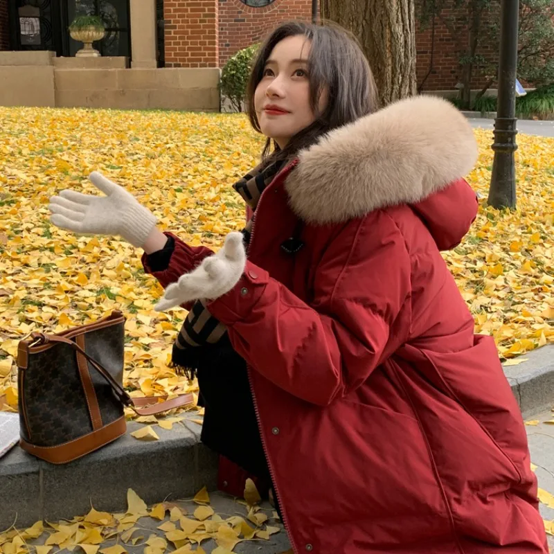 سترة قطن عادية لخريف وشتاء 2025 النسخة الكورية كبيرة بياقة من الفرو مع قلنسوة سترات دافئة فضفاضة فوق الركبة معطف قطني #3