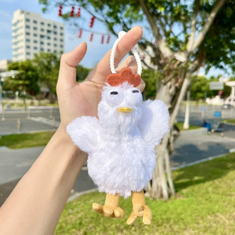 Peluche pulcino che fa l'uovo brutto e carino astratto regalo creativo ciondolo in peluche portachiavi con ciondolo zaino bambola che fa l'uovo