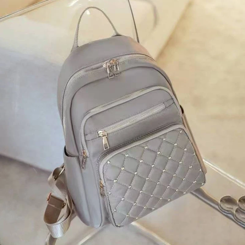 

Модный женский черный рюкзак со стеганым дизайном с шипами для повседневного использования, поездок на работу, практичная универсальная модная сумка