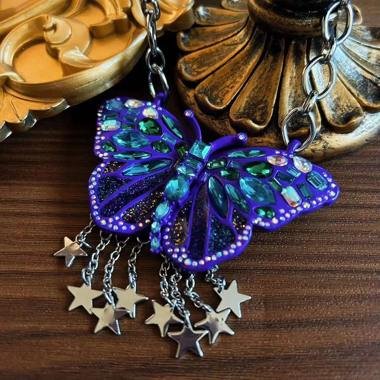 exaggerated butterfly necklace with blue tassels