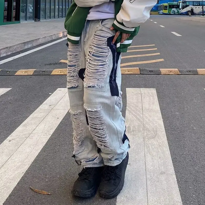 High Street Hip Hop Cuciture strappate Jeans decostruiti Design Sense Pantaloni a gamba dritta con toppa vintage Uomo Donna