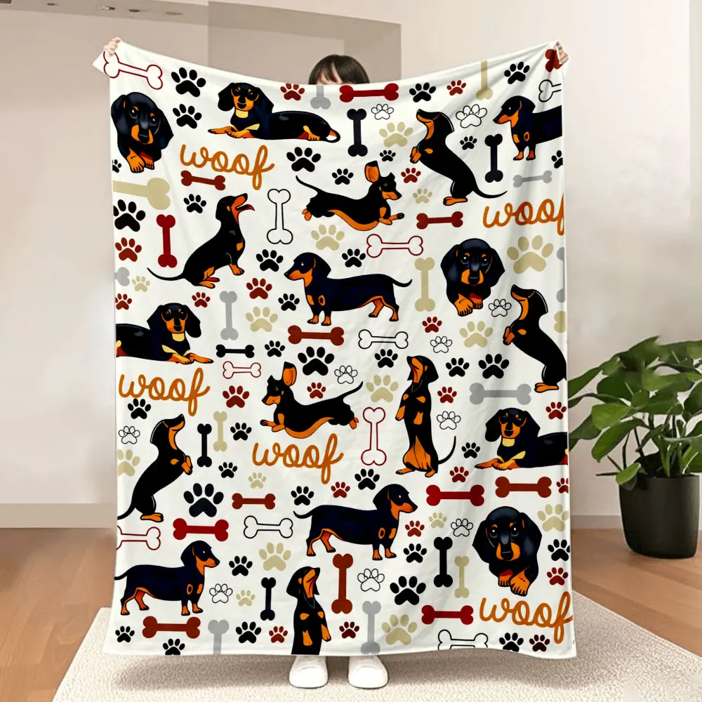 Manta con estampado de perro salchicha: diseño caprichoso de perro negro y tostado con estampados de patas, huesos y texto